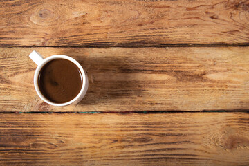 one cup coffee on wooden background