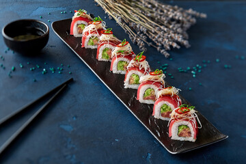 Sushi rolls with tuna, grated daikon, green onion and hot pepper