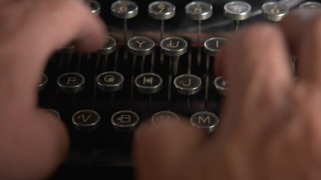 Person typing on a typewriter
