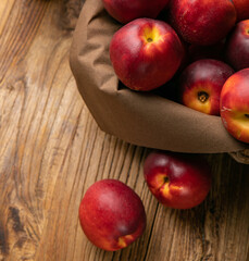 Ripe peaches on a wooden farm table
