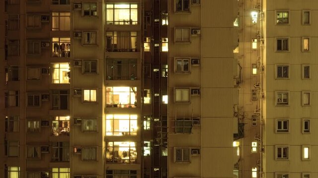 Windows group on and off timelapse of Hong Kong crowded residential apartment building
