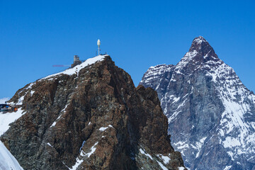 The matterhorn: one of the most iconic and famous mountains in the Alps. The Cima is surrounded by glaciers, rock faces and fantastic landscapes near the town of Cervinia, Italy - June 2021