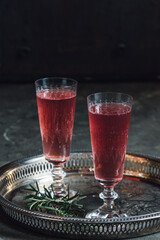 pink sparking rose champagne flute on silver tray 