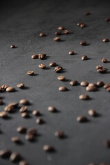 Fototapeta na wymiar Coffee Beans on dark background on the floor