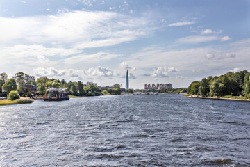 Fototapeta premium Urban landscape from the bridge to the river and the city