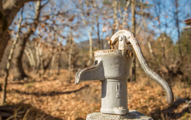 A pump that helps draw water from the well