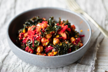 Vegan salad of chickpeas, crispy kale, beetroot and avocado