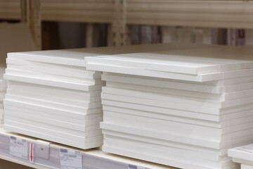 Furniture shelf white made of laminated particle board, selective focus.