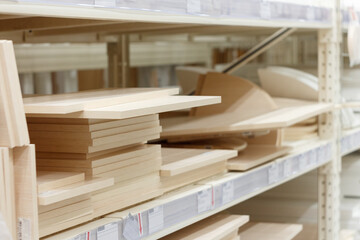 Different shelves for furniture on a shelf in a store, selective focus.