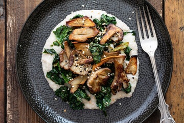 White bean puree with crispy kale and mushrooms