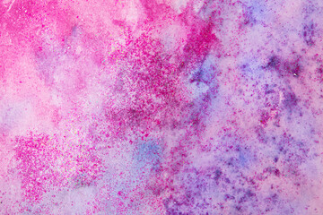 Purple watercolor stains with glitter sequins. Abstract background