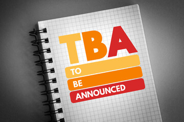 TBA - To Be Announced acronym on notepad, business concept background