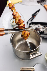 The kebab is removed from the skewer