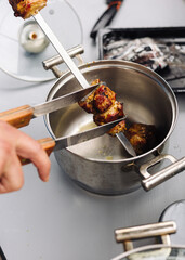 The kebab is removed from the skewer