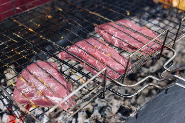 The steak is grilled. Steak on the wire rack.