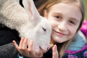 Little girl with a lamb