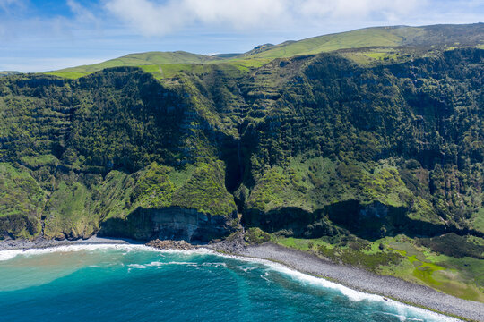 Aerial view of a small beach along the wild coastline near Ponta Delgada, Azores islands, Portugal.