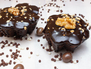 delicious chocolate candie with nuts  on the top under the white table