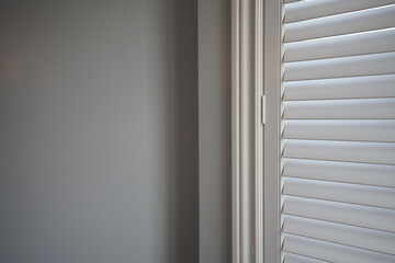 Obraz premium Interior of a Bedroom with Window Shutter
