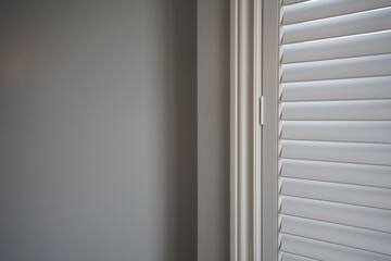 Interior of a Bedroom with Window Shutter