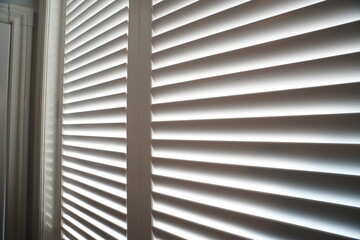 Interior of a bedroom with window shutter blind s