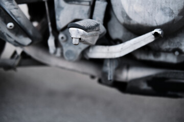 Footrest and speed pedal of the motorcycle. Concept of travel, leisure sports and hobbies. Close up