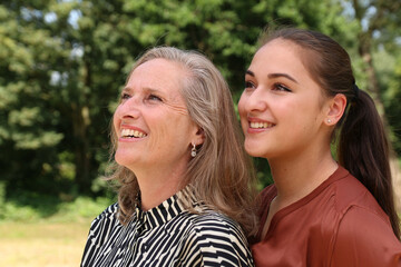 Obraz premium Mother and daughter being happy outside