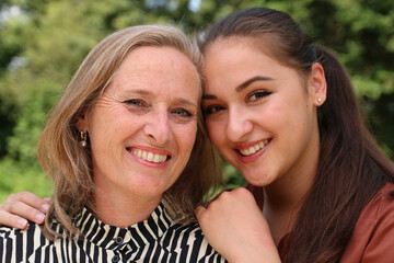 Obraz premium Mother and daughter being happy outside