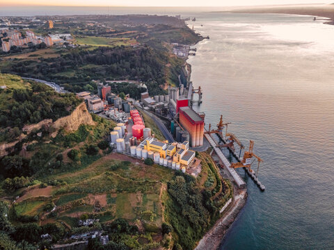 Aerial view of Repsol industry complex at sunset along Tagus river in Caparica, Setubal, Portugal.