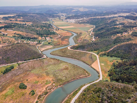 Aerial view of Praia de Odeceixe along Ribeira de Seixe river, Odeceixe, Faro, Portugal.