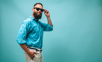 Portrait of handsome, young, stunning, perfect, manly man successful macho man with beard wearing casual isolated color background