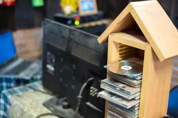 CD rack made of old wood and CD readers, used extensively in the past, now replaced by new...