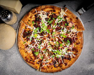 Appetizing pressed crackling pizza, on a base.
