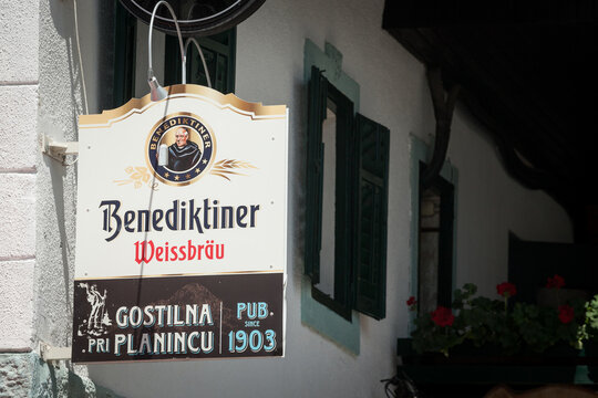 LJUBLJANA, SLOVENIA - JUNE 13, 2021: Benediktiner weissbier logo in front of a Slovenian bar. Benediktiner s a Weissenbier type wheat beer, produced by licher privatbrauerei...