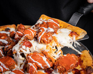 Exquisite boneless pizza with buffalo and cheese.