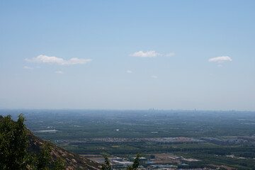 The top of the mountain overlooks the suburbs of Beijing in the distance
