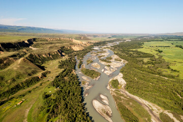 Grassland and river in a sunny day.