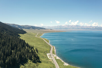 Lake and grassland with a sunny day. Shot in Sayram Lake in Xinjiang, China.
