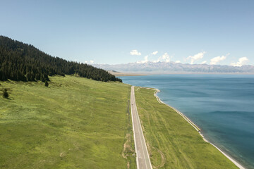 Lake and grassland with a sunny day. Shot in Sayram Lake in Xinjiang, China.
