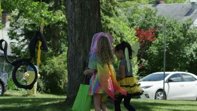 Girls on halloween trick or treating in costume