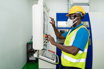 African American technician engineer operating milling cutting machine