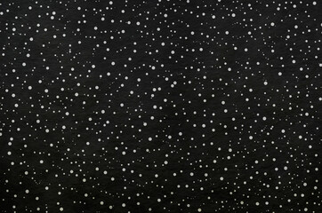 Black washi paper with white snowy sky landscape pattern. Japanese traditional craftsman's handmade paper texture background