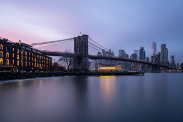 Fototapeta na wymiar Brooklyn bridge and Manhattan skyline at night, long exposure