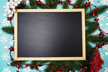 Blackboard and Christmas Oranament decoration on blue background