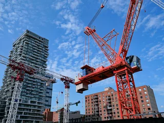Poster construction site with multiple cranes for construction of a new high rise apartment building © Spiroview Inc.