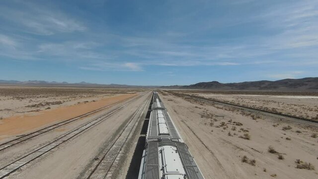 Cargo Trains on desert railways aerial FPV