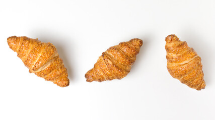 three tasty croissants on white background. French food. Flatly