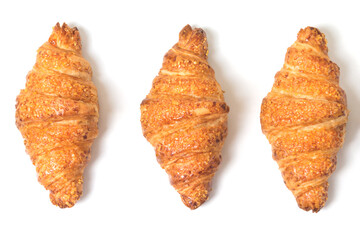 three tasty croissants on white background. French breakfast. Flatly
