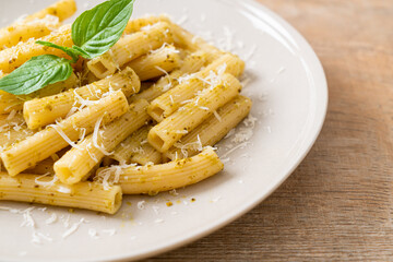 pesto rigatoni pasta with parmesan cheese
