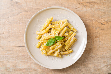 pesto rigatoni pasta with parmesan cheese